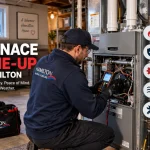 Current image: Professional HVAC technician performing a furnace tune-up in a Hamilton home with combustion, safety, and airflow checks.